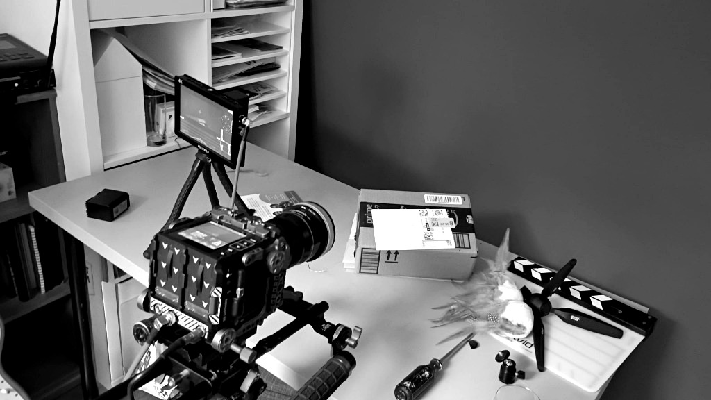 Behind the scenes: Camera rig and creature puppet on desk