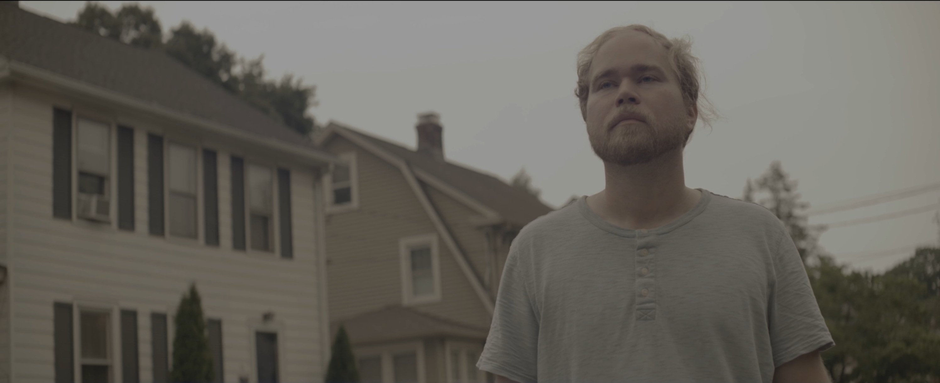 Figure standing near houses